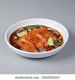 Hot and spicy salmon salad mix vegetable tomato herb and spices Thai style food. Traditional of freshly prepared Thai food. Healthy and spicy menu for street food in Thailand. Selective focus. - Shutterstock ID 2369503267