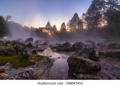 The hot spring with a 73 degree Celsius water spring over rocky terrain. heat from the hot spring providing a misty and picturesque scene which is particular beautiful in the morning at National Park - Powered by Shutterstock