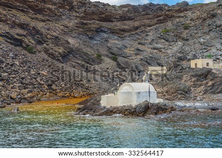 Hot springs of  Palea Kameni near with volcano and small  church of Saint Nikolas. Located in the Caldera of Santorini(Thira) island.Cyclades.Greece.Europe.
