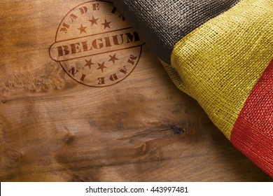Hot stamp imprint on a wooden surface - Made in Belgium. Belgium flag.