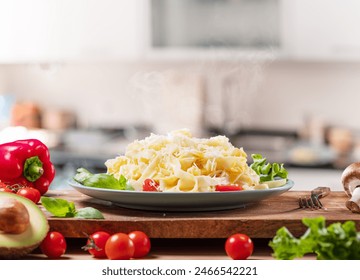 Hot, steaming freshly prepared pasta dish and fresh vegetables near it, Pasta is mediterranean Italian traditional cuisine. - Powered by Shutterstock