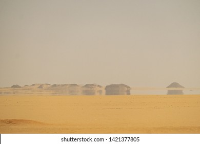 The Hot Sunlight Make A The Mirage Refraction On The Dry Sahara Desert Arab In Summer Landscape