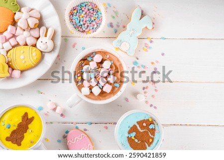 Hot sweet drinks for Easter party, breakfast, lunch. Easter menu. Pink, yellow, blue, brown multicolored hot chocolate cups with marshmallows, chocolate drawing rabbit, Easter eggs on latte surface