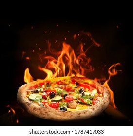 Hot Tasty Pizza With Fire Flames On Dark Background. Image For Menu Or Poster