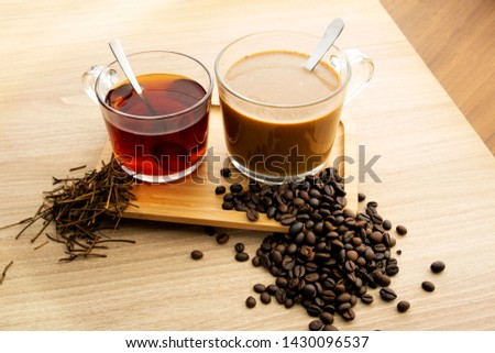 Hot tea and coffee With tea leaves and coffee beans