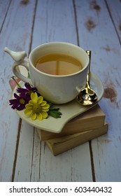 Hot Tea on Stack of Books
