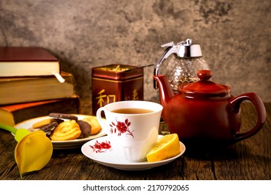 Hot tea served with lemon and honey.