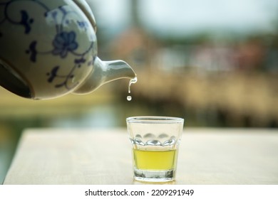 Hot Teapot Pouring Tea Into A Glass, Close-up