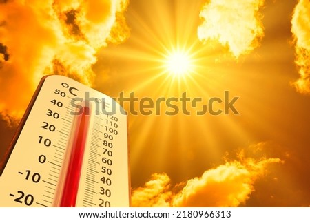 hot temperature,Thermometer on yellow sky with sun shining in summer show higher Weather, concept global warming 商業照片 © 