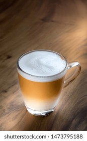 Hot Thai Tea Latte On Wooden Table 