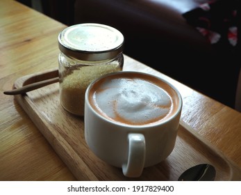 Hot Thai Tea In A White Cup On A Wooden Floor At A Cafe