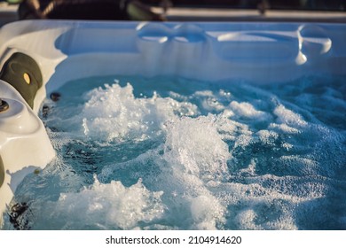 Hot tub hydromassage pool. Illuminated pool. Rest outside the city. Cottage with hydromassage pool - Shutterstock ID 2104914620
