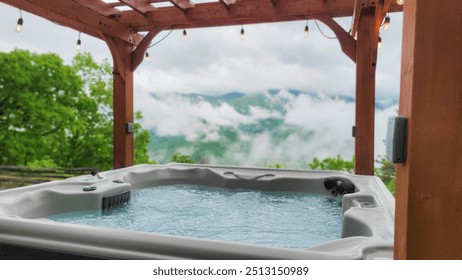 Hot tub spa and smoky mountains under lighted pergola - Powered by Shutterstock