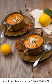 Hot Two Bowls Of Crab Bisque Garnished With Fresh Cooked Dungeness Crab Meat And Green Chives. Garnished With Whole Grain Crackers. Rustic Style.