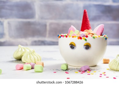 Hot Unicorn Cocoa Or Chocolate In A Porcelain Cup With Funny Eyes. Kids Food Or Drink Concept. Copy Space