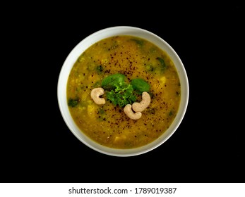 Hot Vegan Yellow Curry Soup With Healthy Vegetables And Green Salad In A White Bowl Top Down Photo With Dark Background Top Down View