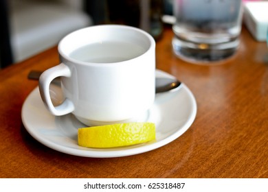 Hot Water Drink With A Slice Of Lemon At A Restaurant 