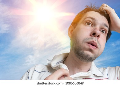 Hot Weather Concept. Young Man Is Sweating. Sun In Background.