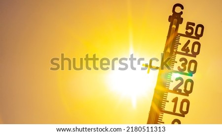 Hot weather - Heat wave, Summer heat background - Thermometer yellow orange sky and sun rays