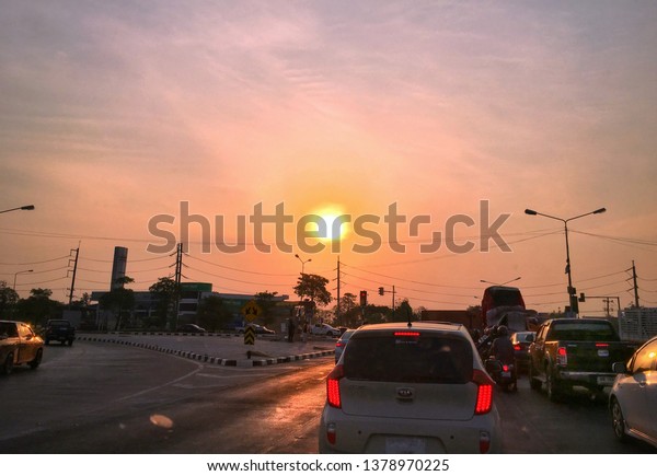 Hot weather\
at the intersection, on April 20, 2019. Many cars are waiting for\
traffic lights in the hot weather in Tha Pho Subdistrict,\
Phitsanulok Province,\
Thailand.