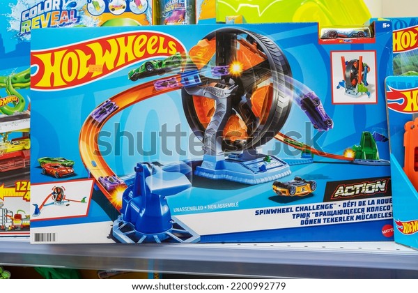Hot Wheels Kids toys for sale at store. Hot Wheels\
is a brand scale die-cast toy cars introduced by American toy maker\
Mattel. Toys under this brand first appeared in 1968. Minsk,\
Belarus, 2022