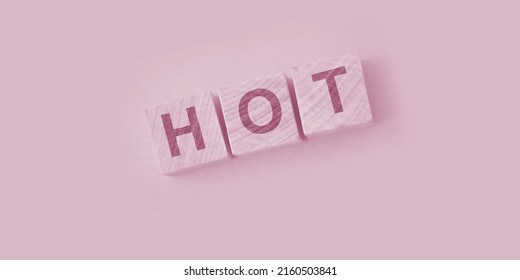 HOT Word Written On Wooden Blocks And Placed On A Yellow. Vacancy, Sale And Hot Seat Concept.