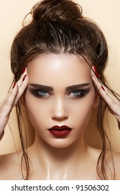 Hot Young Woman Model With Sexy Dark Red Lips Makeup, Strong Eyebrows, Clean Shiny Skin And Wet Bun Hairstyle. Beautiful Fashion Portrait Of Glamour Female Face