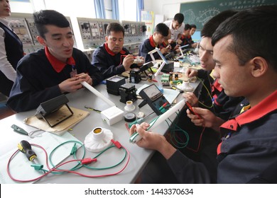 HOTAN, CHINA - APRIL 27 2019. Uighurs learn the profession of electrician at reeducation camp (vocational skills training center) in Moyu County, Hotan Prefecture in Xinjiang.