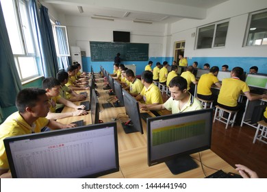 HOTAN, CHINA - APRIL 27 2019. Uighurs learn the computer science at reeducation camp (vocational skills training center) in Moyu County, Hotan Prefecture in Xinjiang.