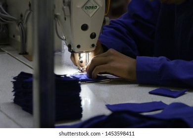 HOTAN, CHINA - APRIL 27 2019. Uigur Women Work In A Cloth Factory In Hotan County, Xinjiang Province, China.