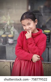 Hotan,China - October 03,2017: Uyghur Girl Plays In The Local Market On October 03, China.