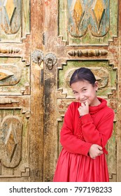 Hotan,China - October 03,2017: Uyghur Girl Plays In The Local Market On October 03, China.