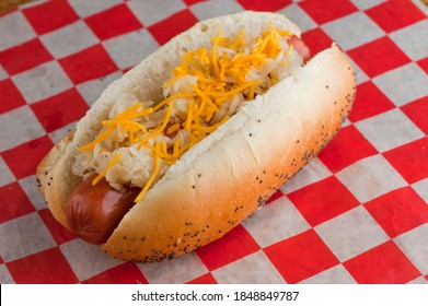 Hotdogs. Classic American Food Favorite. Hotdogs Topped With Chili, Cheese, Onions, Relish, Pickles, Sauerkraut, Mustard And Ketchup. Traditional Bar Food Favorite.