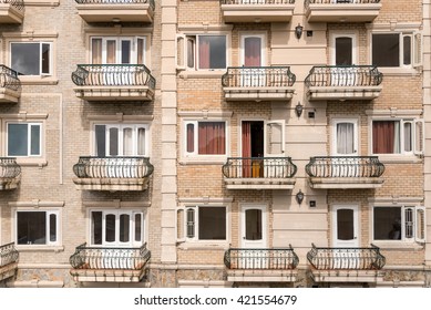 Hotel apartment balcony texture pattern. Detail of the facade of a apartment building, outdoor view of rows of balconies / terrace