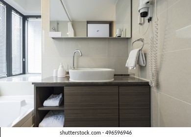 A Hotel Bathroom With Blind, Sink(basin), Bathtub(bath), Lighting Front View At The Day In Seoul, South Korea.