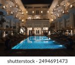 Hotel, the best hotel in town, showed beautiful lighting at evening around the swimming pool, 