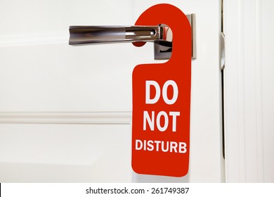 Hotel Do Not Disturb Red Sign On White Door