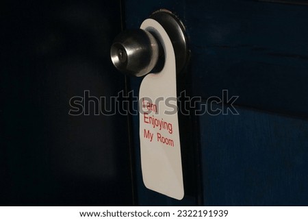 Hotel door privacy hanger. Enjoying my room tag hanging in the dor knob.