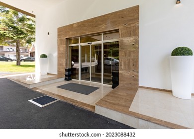 Hotel entrance sliding door with marble wall