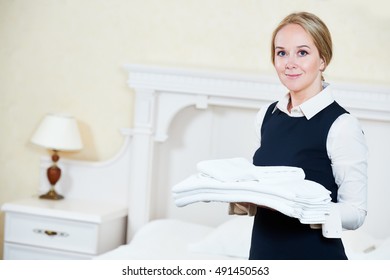 Hotel Female Housekeeping Worker With Linen