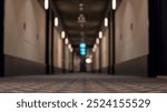 Hotel hallway with selective focus on the carpet and blurred background. Corridor aisle at hotel.