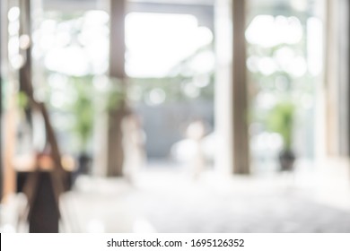 Hotel Or Office Building Lobby Blur Background Interior View Toward Reception Hall, Modern Luxury White Room Space With Blurry Corridor And Building Glass Wall Window