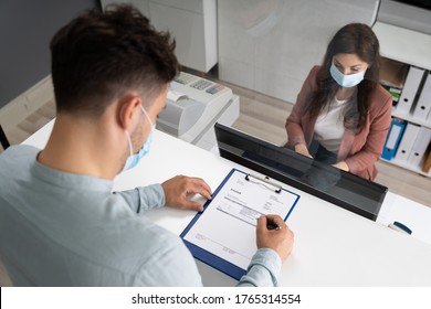 Hotel Reception Desk Protected By Medical Mask From Covid 19