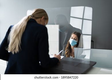 Hotel Reception Desk Protected By Medical Mask From Covid 19