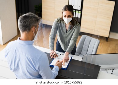 Hotel Reception Desk Protected By Medical Mask From Covid 19