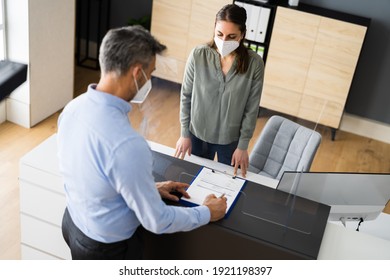 Hotel Reception Desk Protected By Medical Mask From Covid 19