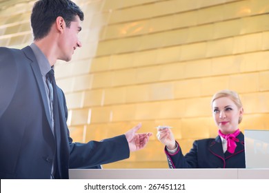 Hotel Receptionist Check In Man Giving Key Card