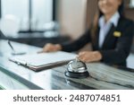 Hotel receptionist in uniforms at desk in lobby Friendly and welcome staff in hotel reception counter.