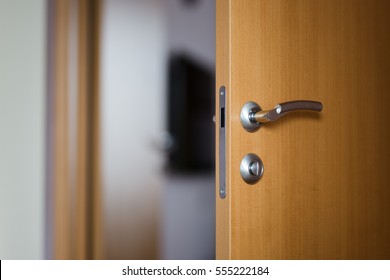 Hotel room or apartment doorway with open door