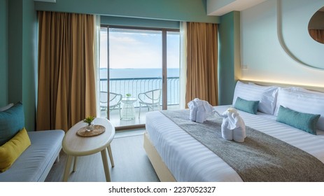 A hotel room with bright fresh colors in Bali style, minimal style bedroom with ocean view
